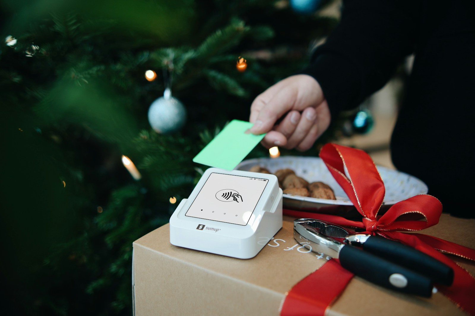 A person putting a green card into a box